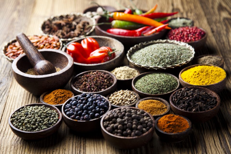 Spices on wooden bowl background